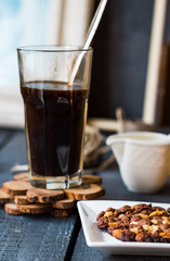 Black coffee cup with biscuits and chocolate