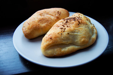 Pair of salt cakes on dark background