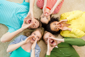 smiling people lying down on floor and screaming