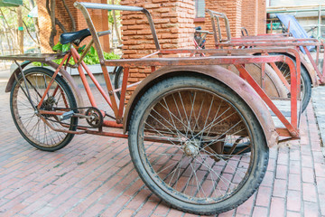 Fototapeta na wymiar red trishaw for transportation in parking
