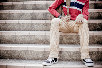 young man sitting on the stairs