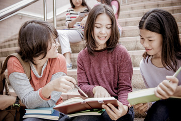 group of happy teen high school students outdoors