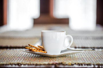 White espresso cup with biscuits