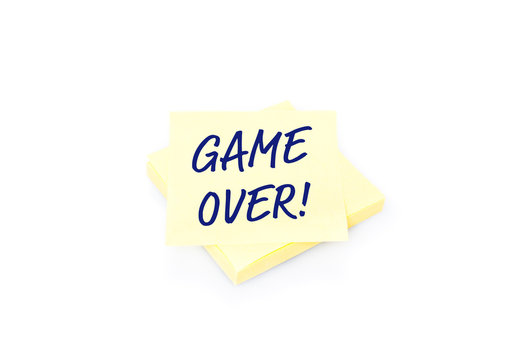Yellow sticky note on block with text Game Over