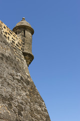 Closeup of Northeastern lookout tower against blue sky.