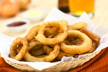 Homemade beer-battered onion rings in a basket