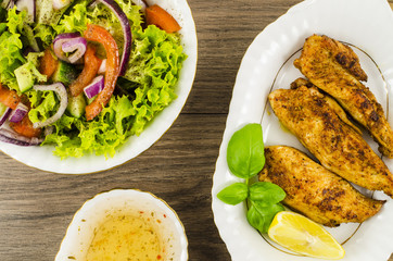 Fried chicken with vegetables salad