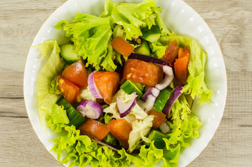 Vegetables salad on wooden table