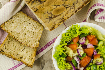 Handmade bread with vegetables salad
