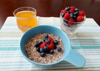 A bowl of oatmeal topped with fresh fruit