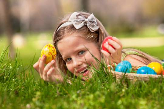 Child find easter egg outdoor.