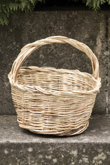 Wicker basket on a stone bench