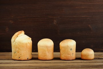 Kulichi, traditional Russian easter cakes on wooden background