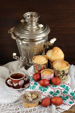 Kulichi, traditional Russian easter cakes with samovar, black te