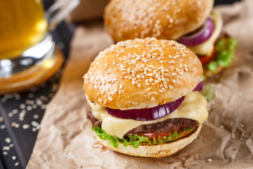 Delicious burger on wooden board
