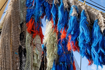 Fishing nets with blue ropes on a fishing boat