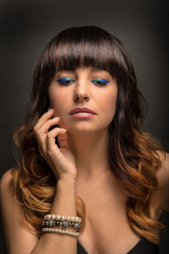Portrait of Beautiful Woman with Colorful Makeup