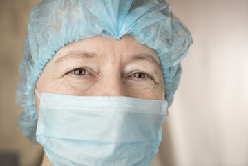 Smiling female doctor in hospital hallway