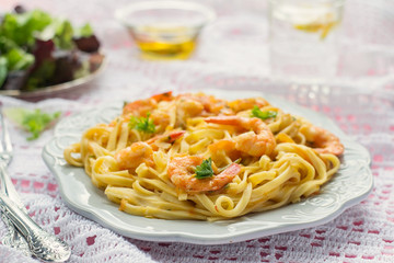 Pasta with shrimps and tomato sauce