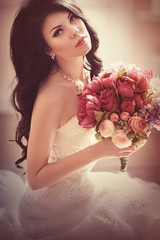Beautiful bride brunette in white dress