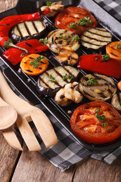 vegetables: peppers, tomato, onion,  in pan grill. Vertical