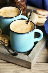 Beautiful composition with tasty cappuccino on wooden table