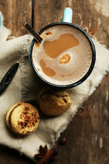 Beautiful composition with tasty cappuccino on wooden table