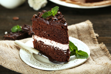 Delicious chocolate cake on table close-up