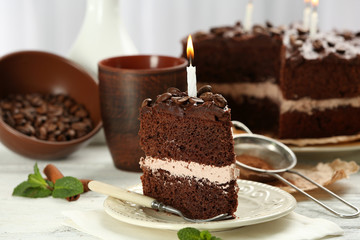 Delicious chocolate cake on table on light background