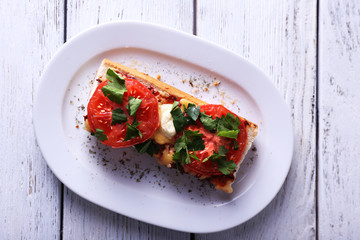 Tasty sandwich with vegetables and cheese