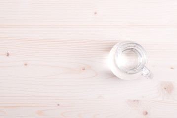 water in a glass and a napkin on the board