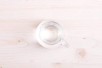 water in a glass and a napkin on the board