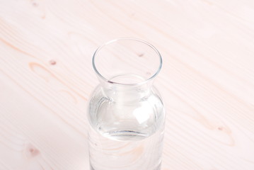 water in a glass and a napkin on the board