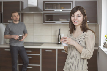 Housewife in kitchen with coffee