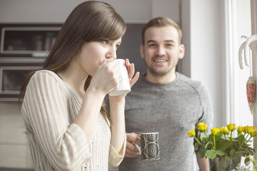 Man and woman drinking coffee