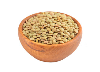 Green lentil in wooden bowl, isolated on white background