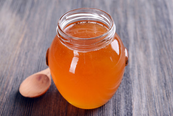 Delicious honey on table close-up