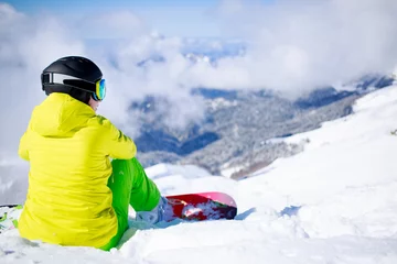 Snowboarder sitting © Sergey