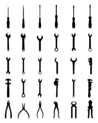 Black silhouettes of pliers, screw wrenches and screwdrivers