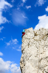 Rock climber on limestone rock near Krakow, Poland