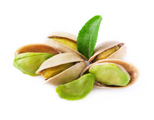 Pistachio with leaves isolated on white.