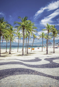 Copacabana Beach with palms and landmark mosaic in Rio