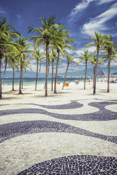 Copacabana Beach with palms and landmark mosaic