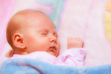 Little newborn baby girl 24 days sleeps