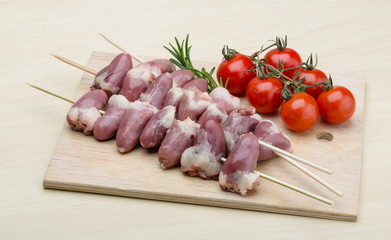 Raw chicken hearts for barbecue