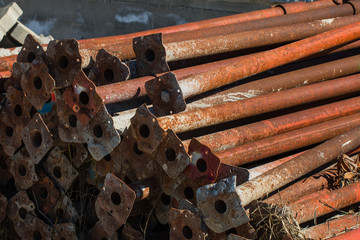 old scaffold tubes storaged outside in a pile