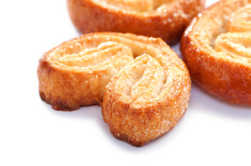 Puff pastry cookies close-up on white background