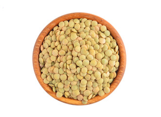 Green lentil in wooden bowl, isolated on white background