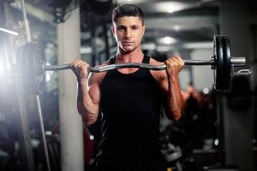 Fototapeta na wymiar handsome man workout in gym