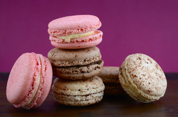 Chocolate, strawberry and vanilla macaroons.